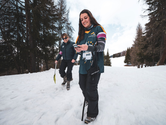 Participants at an Evolution 2 seminar in Les Arcs engaging in team building activities in the snow