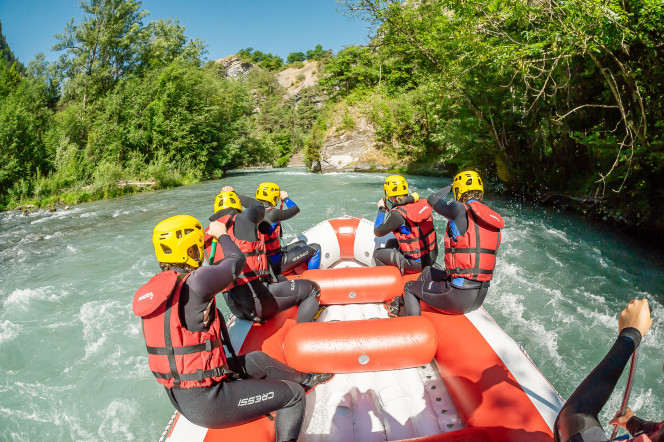 Group rafting down a river with Evolution 2 in Landry.