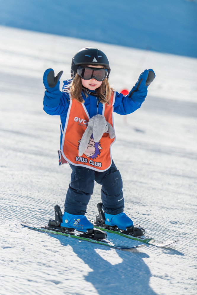 Child taking a beginner ski lesson in Tignes with Evolution 2