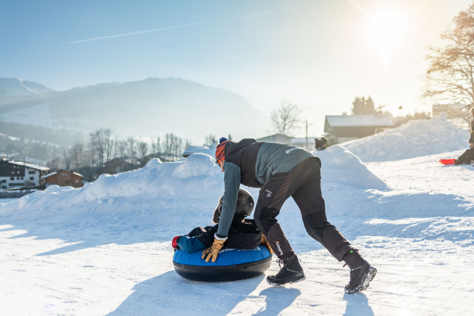 Snowtubing activity for a child at Winter Camp in Megève