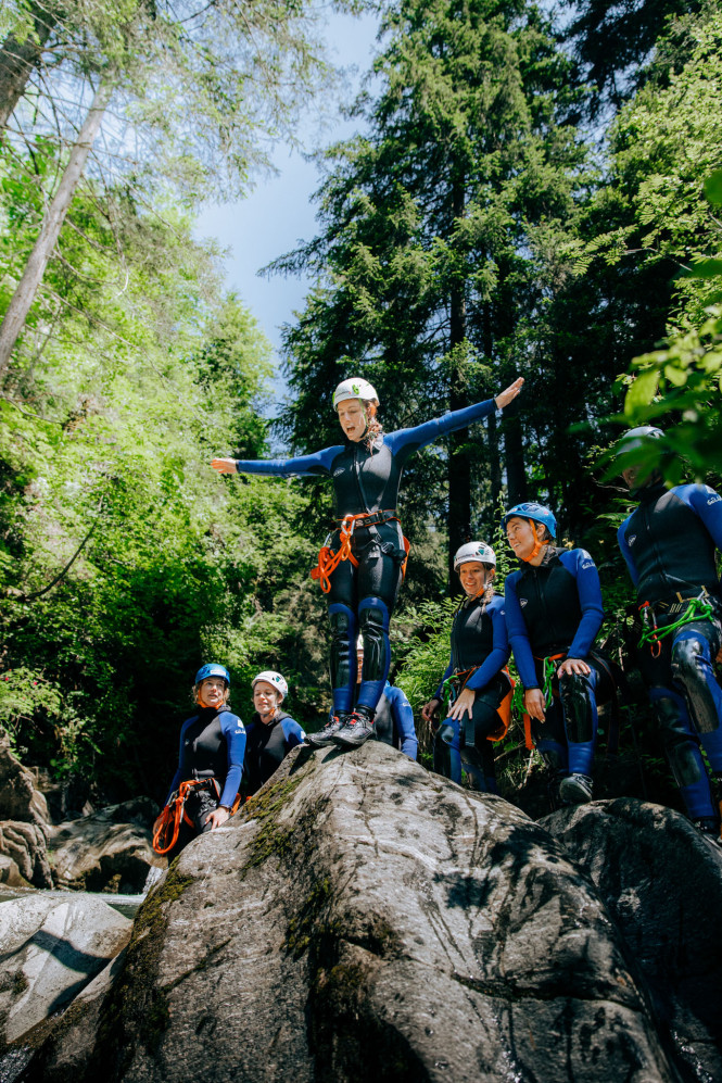 Canyoning activity: a participant ready to jump.