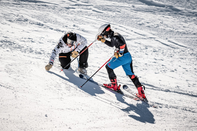 Skier training to become a ski instructor with a coach in La Rosière