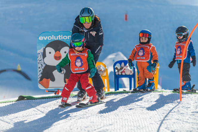 Children in the Evolution 2 Ski School’s Snow Garden with Their Instructor