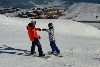 An Improver 1 student in a group lesson with his Evolution 2 Tignes ski instructor.