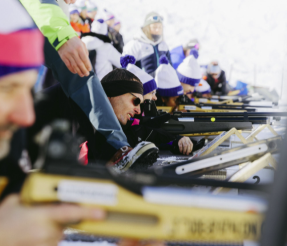 Participant taking part in a biathlon activity during a seminar in La Rosière